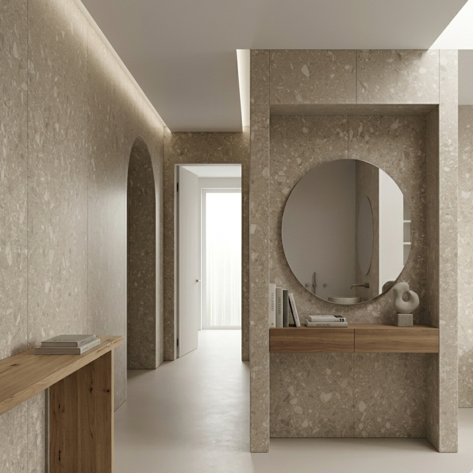 Modern interieur met beige terrazzo SPC wandpanelen, ronde spiegel en houten meubel in hal of badkamer